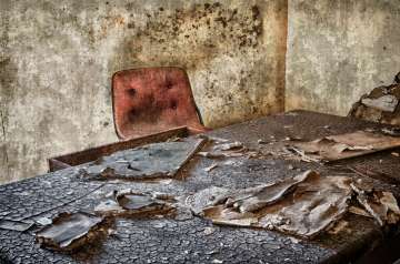 Empty chair in abandoned office
