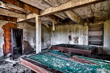 Pool table in disintegrating room