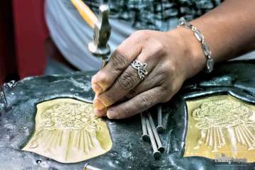 Closeup of metalsmith at work