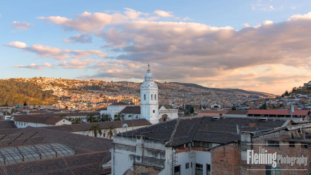Cityscape and cathedral with cloudy morning sky, Old Town, Quito