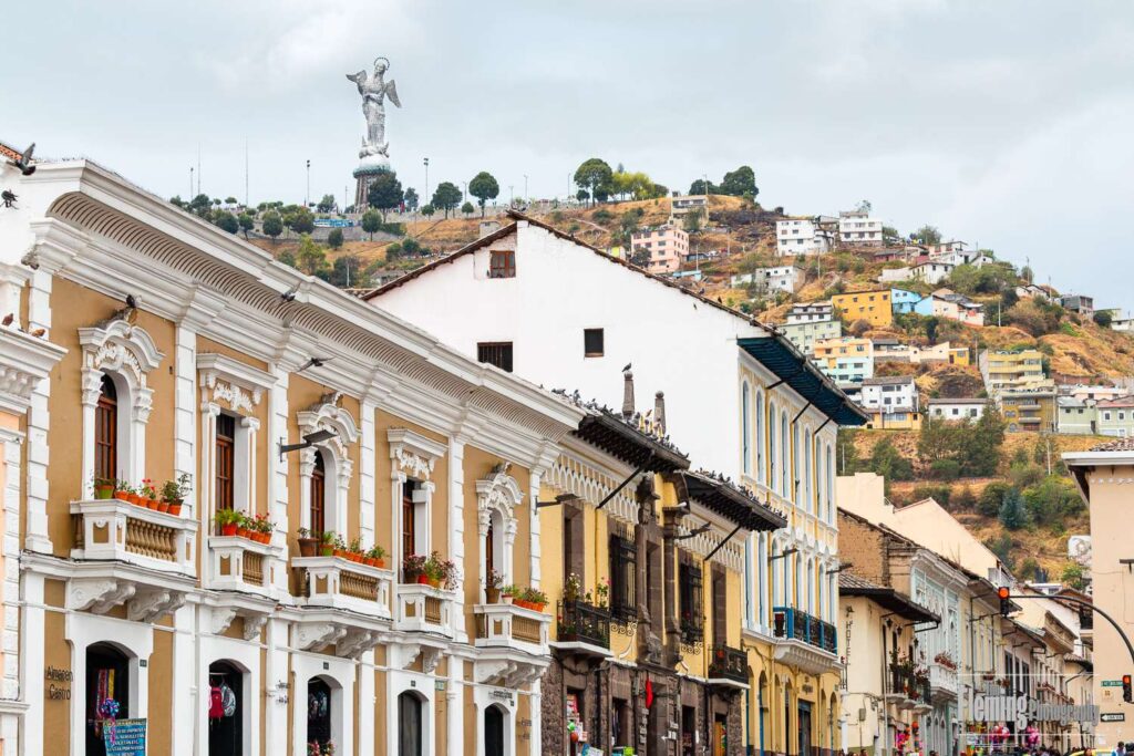 Virgin of the Panecillo, also known as the Virgin of Quito, overlooks a street scene, Old Town, Quito
