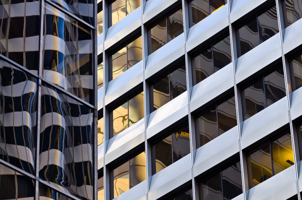Abstract architectural facade with reflective glass windows