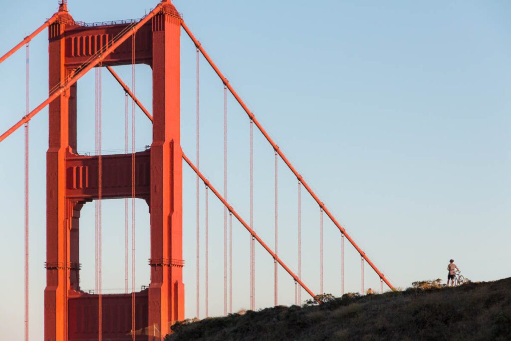 Golden Gate Bridge with a cyclist in the foreground